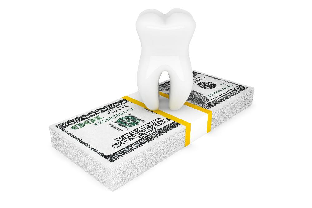 tooth on stack of dollar bills | 11201 dentist office