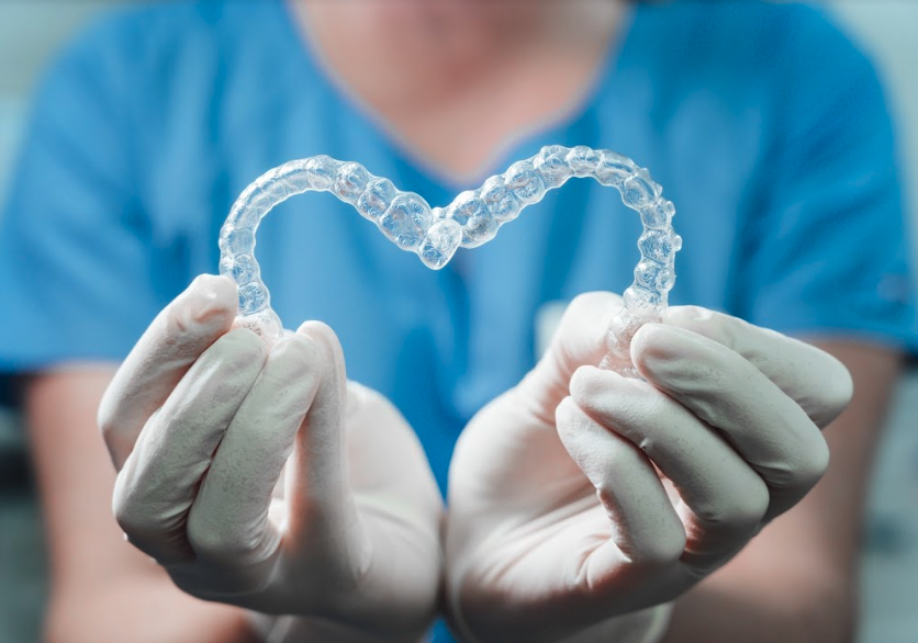 close up of two clear plastic aligners | invisalign dumbo ny