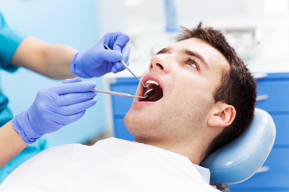 man getting dental exam | dentist 11201