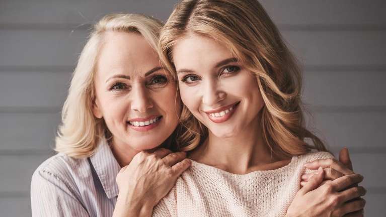 woman and daughter hugging | dental implants in dumbo