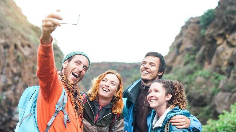 group of four people hiking | dentist dumbo heights